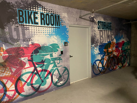 Full-wall printed mural installed in a bike room by Barjo Printing & Signs