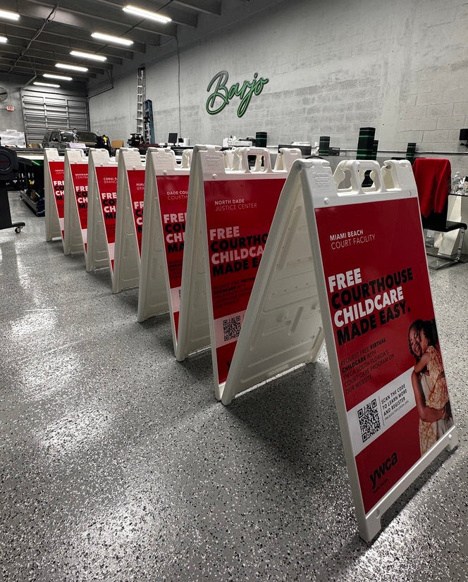 A row of white A-frame sidewalk signs.